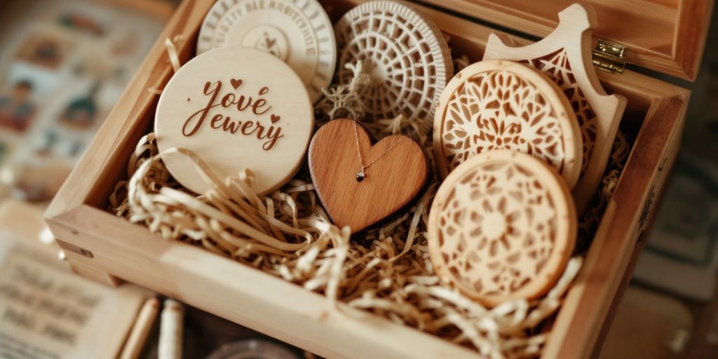 Wooden gift box with handmade woodworking items inside.